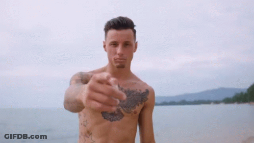 Shirtless Man With Chest Tattoo Holding Up Finger GIF