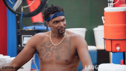 Shirtless Man With Chest Tattoo In Front Of Laugh And Loud Logo GIF