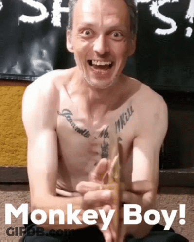 Shirtless Man With Chest Tattoo Smiling Monkey Boy GIF