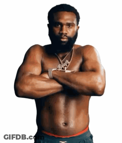 Shirtless Man With Crossed Arms And Booty Necklace GIF