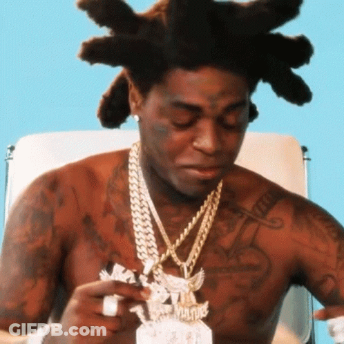 Shirtless Man With Dreadlocks Holding Paper GIF