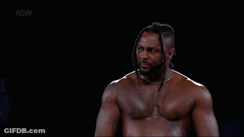 Shirtless Man With Dreadlocks In Dark Room GIF