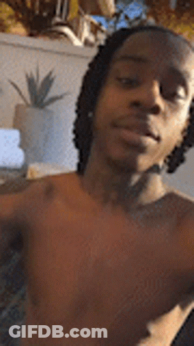 Shirtless Man With Dreadlocks Taking Selfie GIF