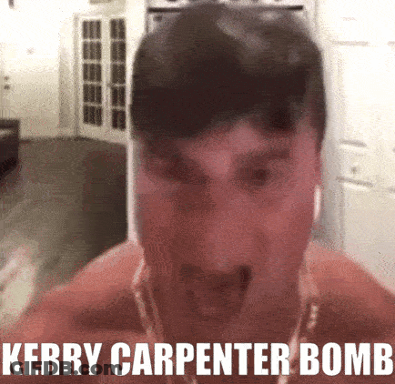 Shirtless Man With Ear Buds And Necklace Saying Kerry Carpenter Bomb GIF