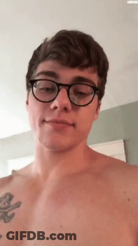 Shirtless Man With Glasses And Chest Tattoo GIF