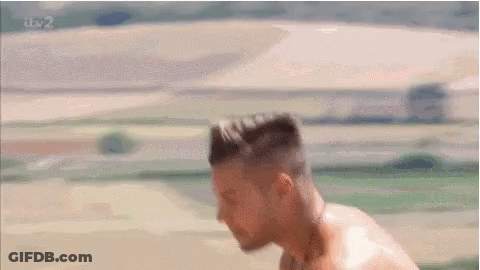 Shirtless Man With Head Down In Field GIF