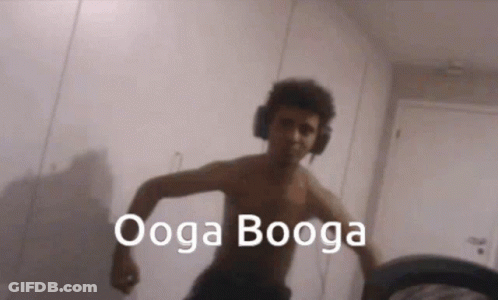 Shirtless Man With Headphones Says Ooga Booga GIF