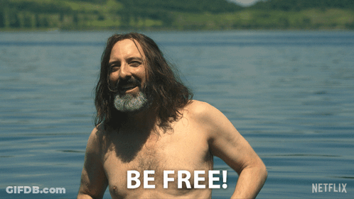 Shirtless Man With Long Hair And Beard In Water Saying Be Free GIF
