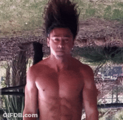 Shirtless Man With Long Hair In Front Of Mirror GIF