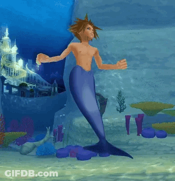 Shirtless Man With Mermaid Tail Standing In Water GIF