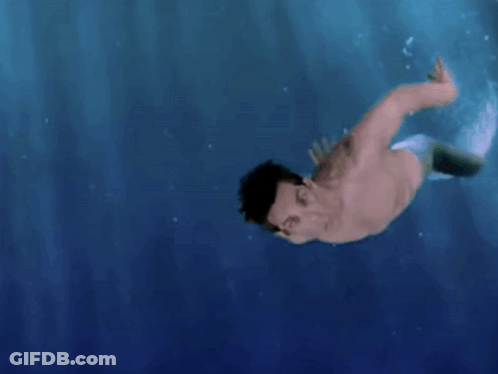 Shirtless Man With Mermaid Tail Swimming GIF
