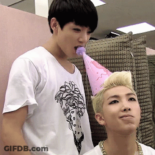 Shirtless Man With Microphone Standing Next To Another Man GIF