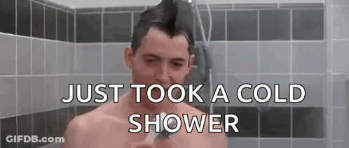 Shirtless Man With Mohawk Taking Cold Shower GIF
