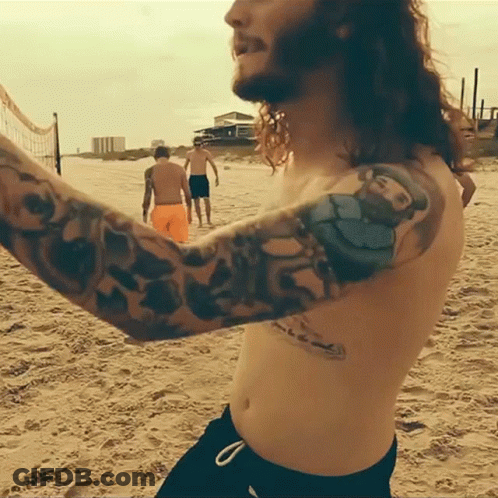 Shirtless Man With O'Neill Arm Tattoo GIF
