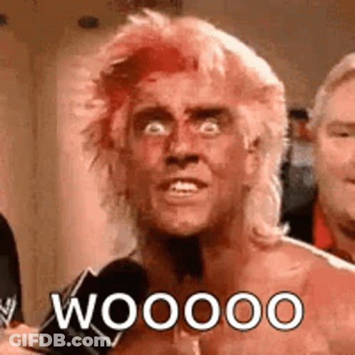Shirtless Man With Red Hair Talking Into Microphone GIF