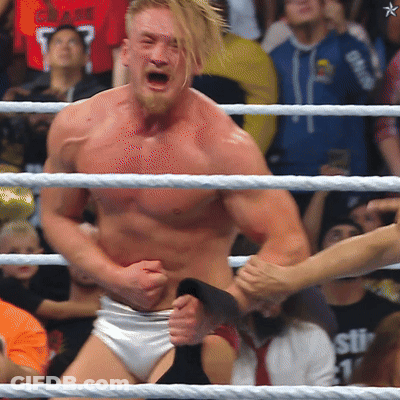 Shirtless Man With Star On Chest In Wrestling Ring GIF