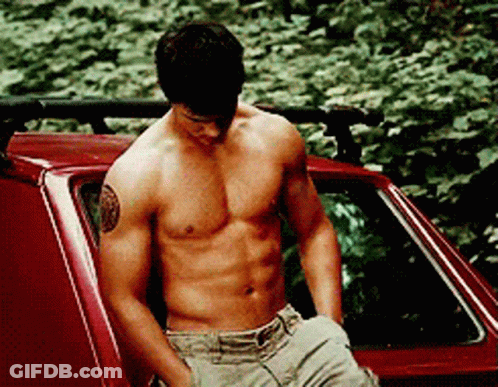 Shirtless Man With Tattoo In Red Car GIF