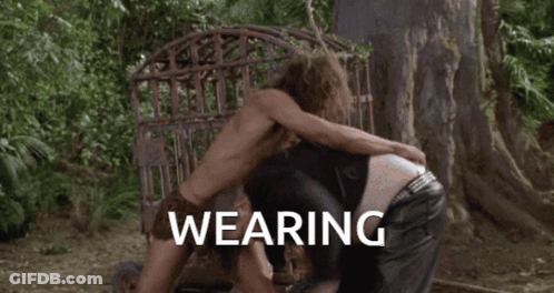 Shirtless Man With Towel Kicked By Another GIF