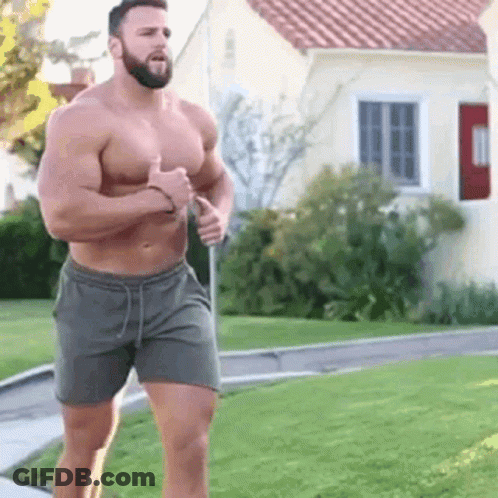 Shirtless Muscular Bearded Man Running Down Sidewalk GIF
