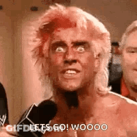 Shirtless Redhead Man Talking Into Microphone Making Funny Face GIF
