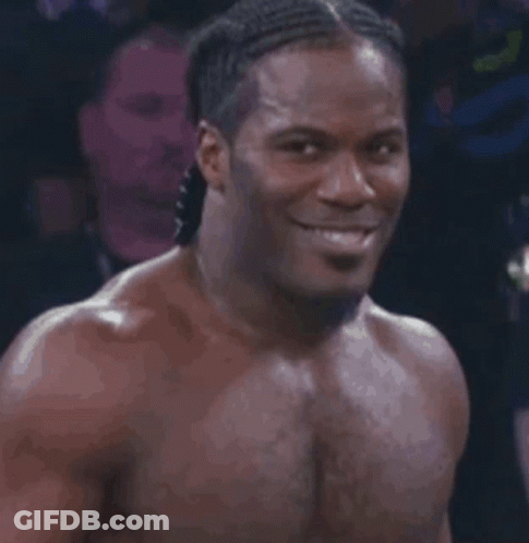 Shirtless Smiling Man In Dark Room GIF