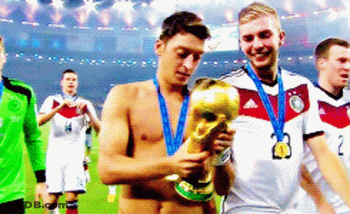 Shirtless Soccer Player Holding Trophy With Medal GIF