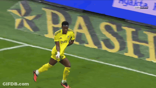 Shirtless Soccer Player Running In Front Of Beko Banner GIF