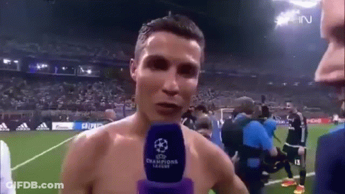 Shirtless Soccer Player Talking Into Microphone GIF