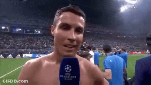 Shirtless Soccer Player Talking Into Microphone GIF