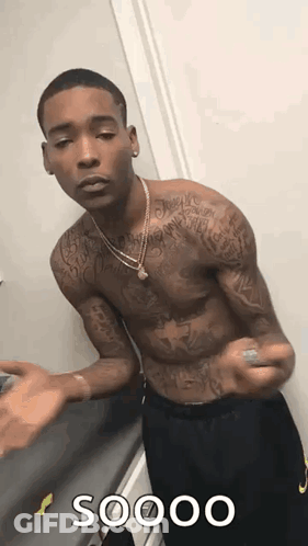Shirtless Tattooed Man At Door GIF