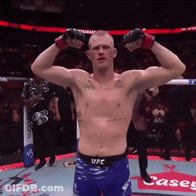 Shirtless UFC Fighter Flexing Muscles In Front Of Casey Sign GIF