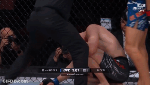 Shirtless UFC Fighter In Front Of Cage GIF
