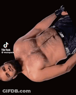 Shirtless UFC Fighter Laying Down With Lightning Eyes GIF