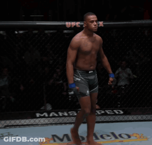 Shirtless UFC Fighter Yelling In Cage GIF