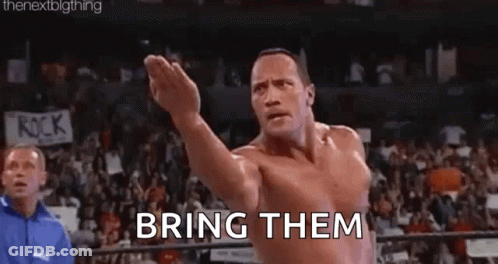 Shirtless Wrestler Arms Outstretched In Ring GIF