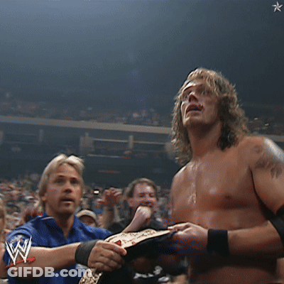Shirtless Wrestler Hands Up In Crowd GIF