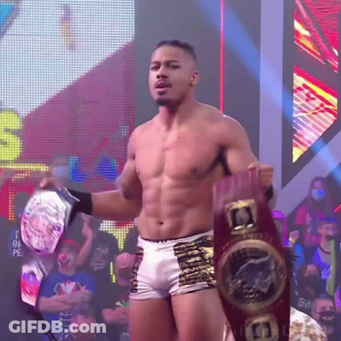 Shirtless Wrestler Holding Championship Belt GIF