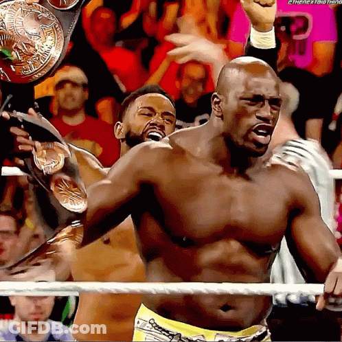 Shirtless Wrestler Holding Championship Belt In Ring GIF