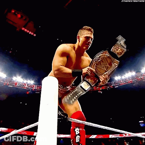 Shirtless Wrestler Holding Championship Belt GIF