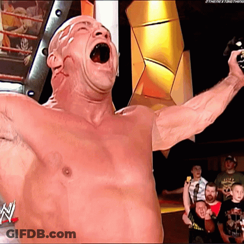 Shirtless Wrestler Holding Microphone With N On Bottom GIF