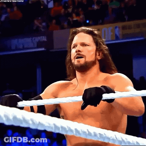 Shirtless Wrestler Holding Rope In Ring GIF
