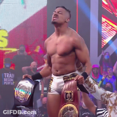 Shirtless Wrestler Holding World Heavyweight Belt GIF