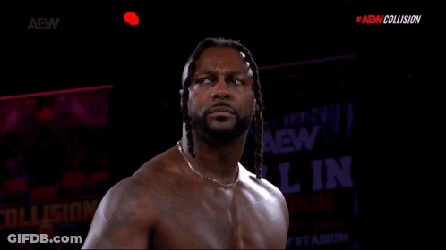 Shirtless Wrestler In Front Of AEW Collision Sign GIF