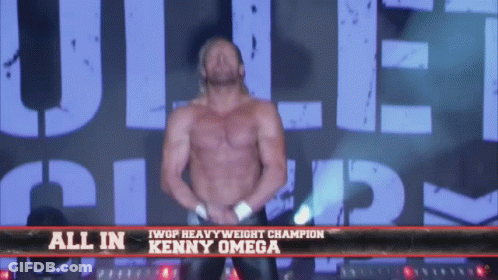 Shirtless Wrestler In Front Of All In Kenny Omega Sign GIF