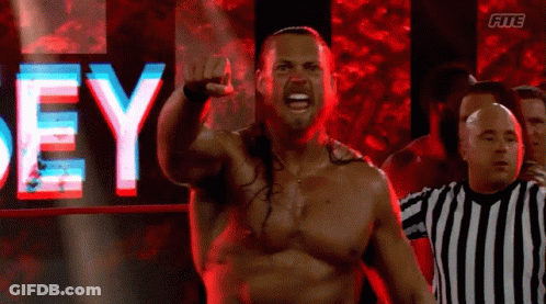Shirtless Wrestler In Front Of Dey Sign GIF
