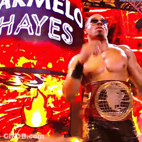 Shirtless Wrestler In Front Of Marvel Hayes Sign GIF