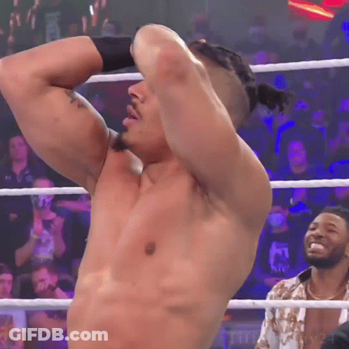 Shirtless Wrestler In Ring Hands Behind Head GIF