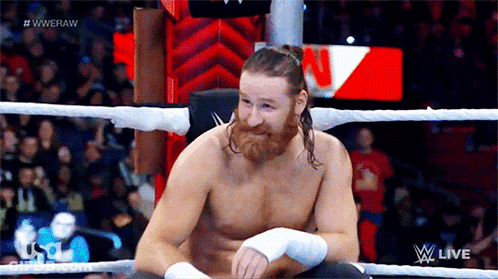 Shirtless Wrestler In Ring Saying Wweraw GIF