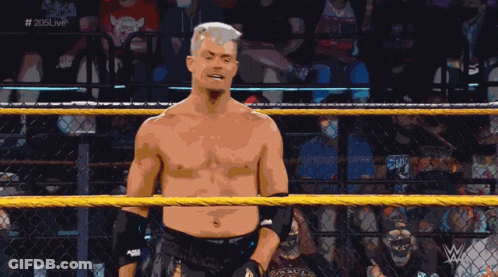 Shirtless Wrestler In Ring With 205Live On Screen GIF