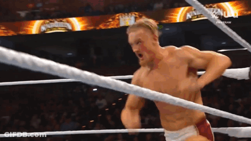 Shirtless Wrestler In Ring With Crowd GIF